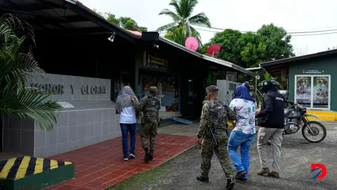 La polic&iacute;a paname&ntilde;a desarroll&oacute; un operativo para cortar una red de tr&aacute;fico de migrantes chinos. Foto: Arnulfo Franco / AFP.